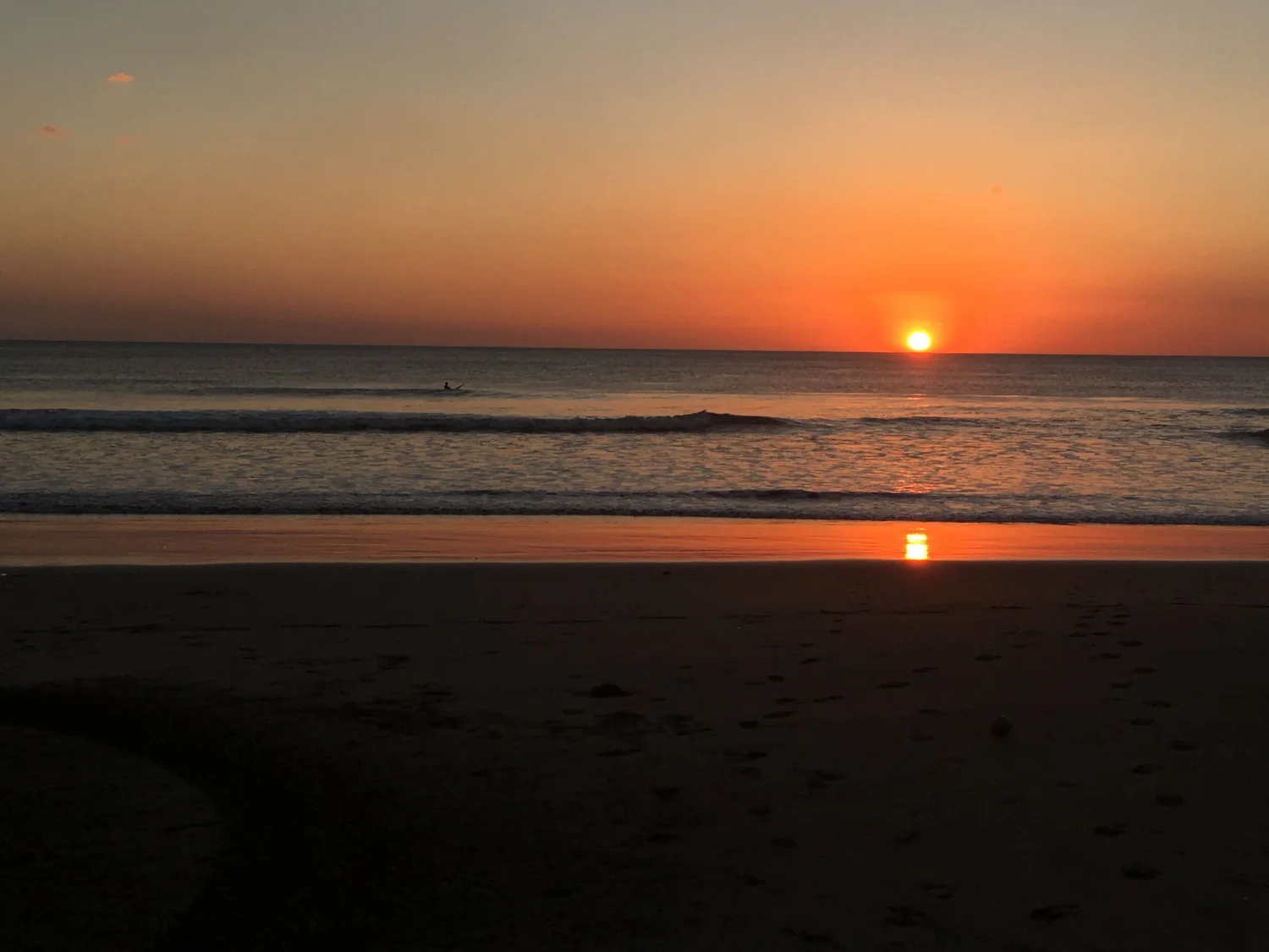 Sun setting over the ocean horizon