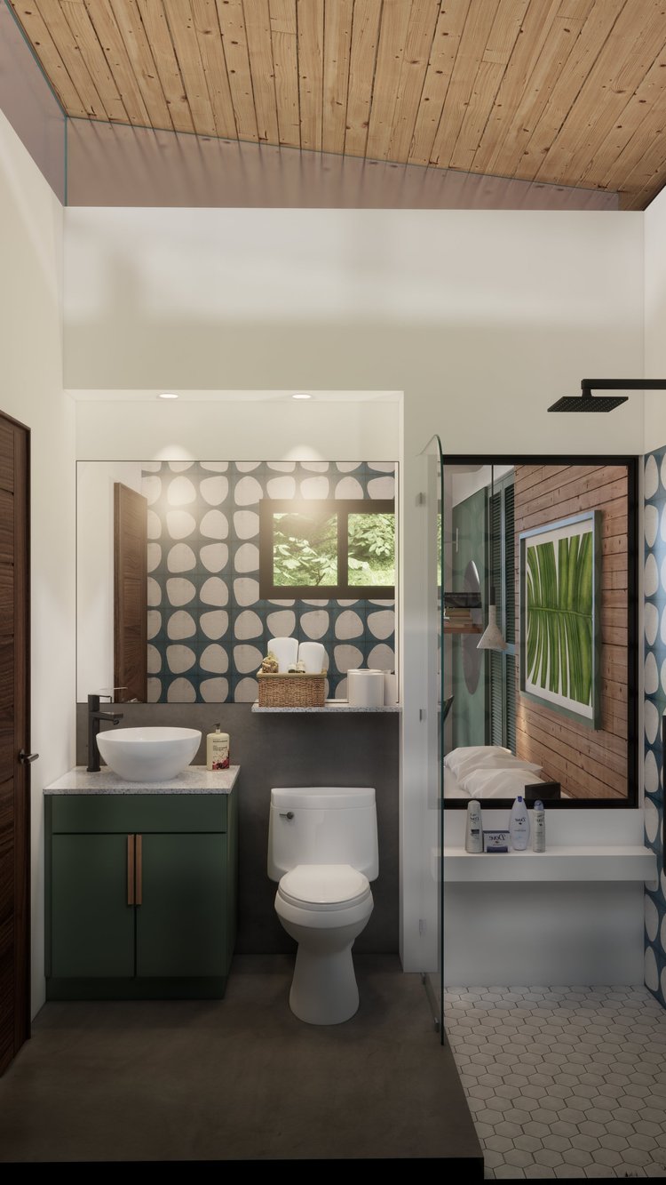 Modern bathroom with a white toilet, green vanity with vessel sink, large mirror, decorative wallpaper, wooden ceiling, and a separate shower area with hexagonal tiles and a wall mirror reflecting a bedroom.