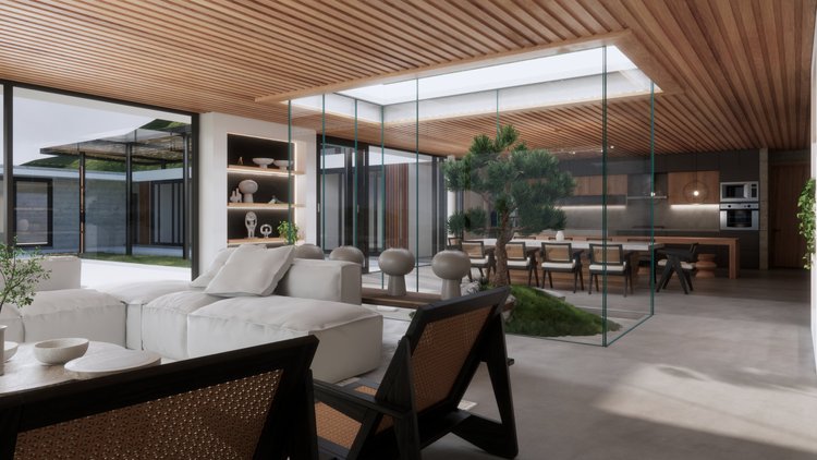 Open-concept living and dining area with modern decor, white sectional sofa, wooden ceiling with skylight, glass walls, indoor plants, and a large dining table with chairs.