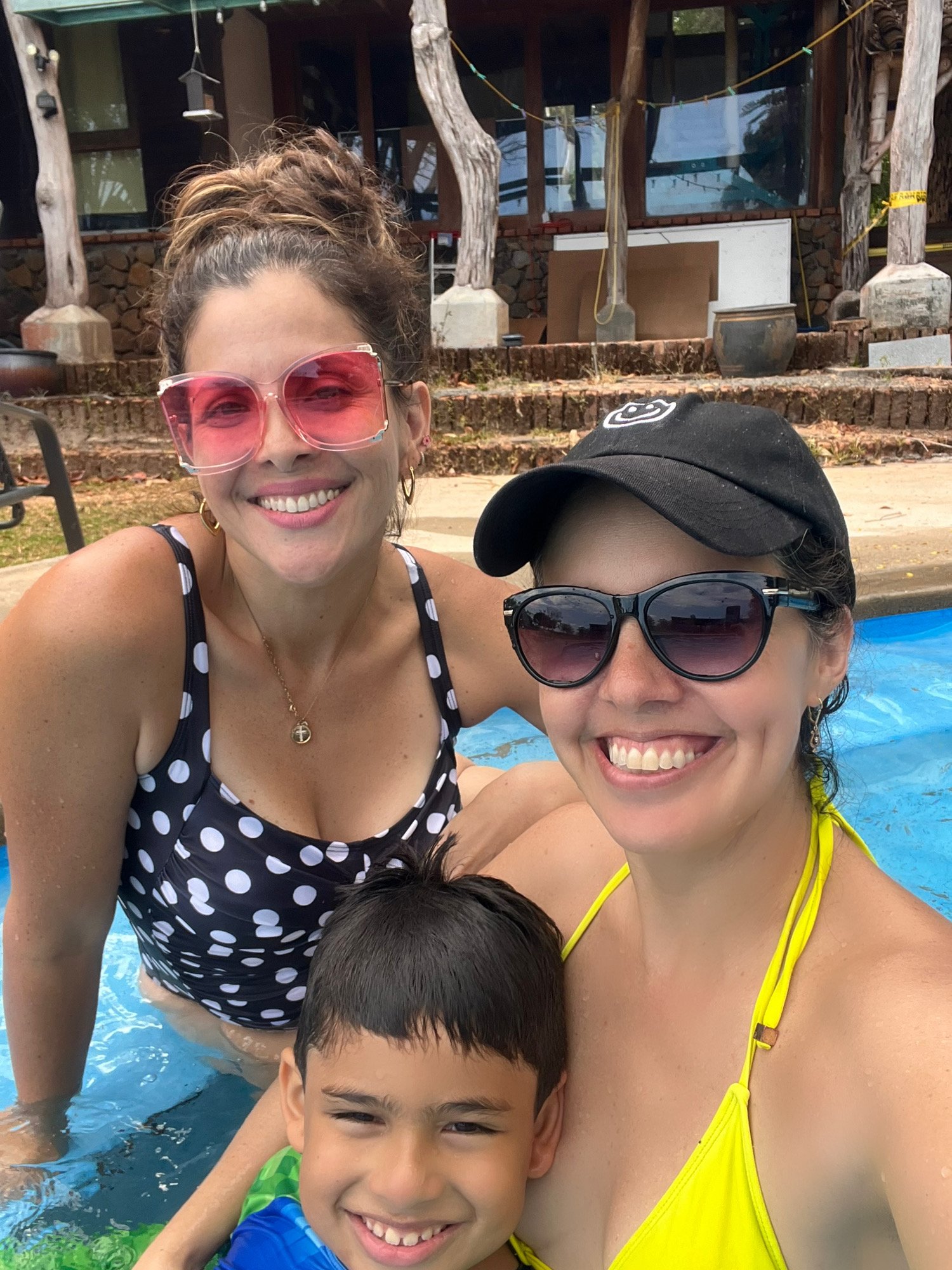 Family swimming in a pool at Veritas Village